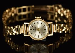 Tissot 9ct gold ladies wristwatch with black hands, two-tone hour markers, silver dial and