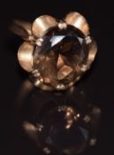 A 9ct gold ring set with an oval cut smoky quartz, 3.2g, size K