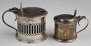 Two hallmarked silver mustards with blue glass liners, one Chester 1908, maker Haseler Brothers