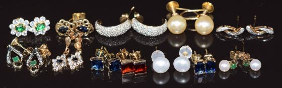 Ten pairs of 9ct gold earrings set with paste, sapphires, diamonds, garnets, pearls, emeralds,