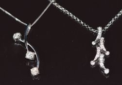 Two 9k white gold pendants set with diamonds, both on 9k white gold chains, 7.2g