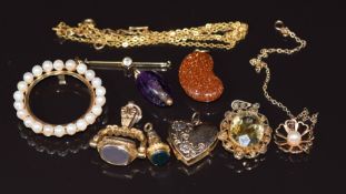 A 9ct gold locket, 9ct gold swivel fob, filigree pendant, 9ct gold pendant set with pearls (9.9g),