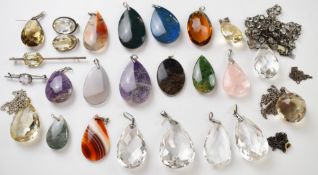 A collection of silver pendants and brooches set with paste and agate