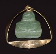 A 9ct gold pendant set with a quartz Buddha, 8.8g