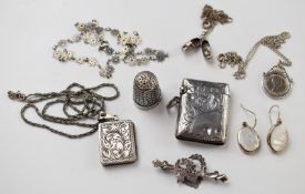 A silver vesta, silver locket and silver thimble, brooch, pendants, etc