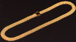 A 22ct gold necklace made up of plaited faceted beads c1960s, 59.8g