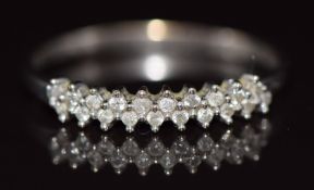 A 9ct white gold ring set with approximately 0.2ct of diamonds, 1.7g, size V