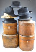 Four tin hat boxes containing bowler hats and a straw boater