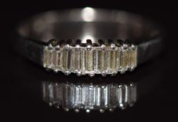 An 18ct white gold ring set with baguette cut diamonds, 2.6g, size N
