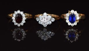 Three 9ct gold rings, one set with a synthetic sapphire, one garnet and the other cubic zirconia,