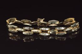 A 9ct gold bracelet made up of faceted links, 13.8g 21cm