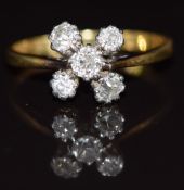 An 18ct gold ring set with five diamonds, 2.9g, size P