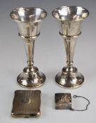 Pair of hallmarked silver trumpet vases or candlesticks (when upturned), height 13cm, hallmarked