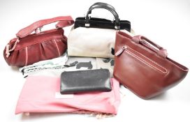 Three small Radley handbags and a purse with sunflower decoration, all with dust bags