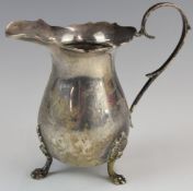 Elizabeth II hallmarked silver jug raised on three lion paw feet, Birmingham 1970, maker Joseph