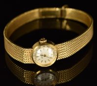 Girard Perregaux 18ct gold ladies wristwatch with gold hands and hour markers, silver dial and