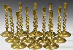 Near set of 12 brass hollow twist candlesticks, height 30cm