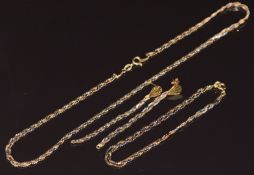 A suite of 18ct gold tri-coloured jewellery comprising necklace, bracelet and earrings, 15g