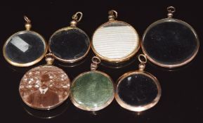 Seven Edwardian 9ct gold lockets, including examples hallmarked Birmingham 1907, two 1908, 1903 &