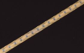A 9ct gold ribbon bracelet with star design, 3.8g 18.7cm
