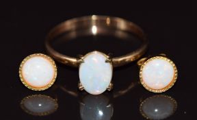 A 9ct gold ring set with an opal (1.1g, size P) and a pair of silver gilt earrings set with an opal