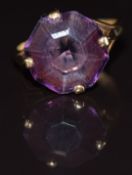 A 9ct gold ring set with a synthetic purple sapphire, 4.2g, size L