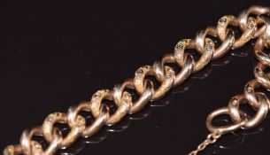 A 9ct rose gold curb link bracelet with engraved links and heart padlock clasp, 19.3g