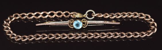 A 9ct rose gold curb link bracelet and a 9ct gold brooch, 12g