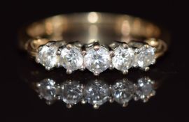 A 14k gold ring set with five cubic zirconia, 3.4g, size P