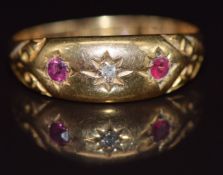 A c1900 18ct gold ring set with a diamond and rubies, 2.1g, size P