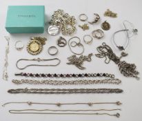 A 9ct gold heart shaped signet ring (1.3g), a collection of silver chains, faux Tiffany and Co