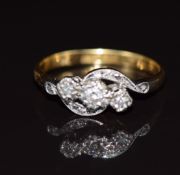 An 18ct gold ring set with diamonds in a platinum setting, 2.5g, size K