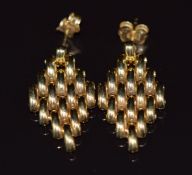 A pair of 18ct gold earrings made up of oval links in a diamond shape, 5.4g