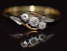 An 18ct gold ring set with diamonds in a platinum setting, 1.9g, size K