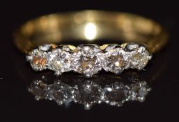 An 18ct gold ring set with five diamonds, 2.1g, size L