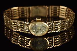 Rotary 9ct gold ladies wristwatch with two-tone hands and hour markers, silver dial and mechanical
