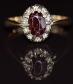 A 9ct gold ring set with a garnet and paste, 3g, size O