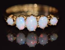 An 18ct gold ring set with five opals, Chester 1904, 2.2g, size M