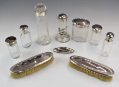 Eleven various hallmarked silver lidded and mounted items comprising two brushes, nail buffer and