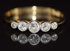 An 18ct gold ring set with five diamonds, 2.1g, size J
