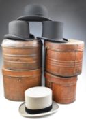 Four top hats in hat tins including 'Gardner, Hatter, Stroud', Christys' of London etc