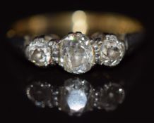 An 18ct gold ring set with three old cut diamonds in a platinum setting, 2.4g, size J