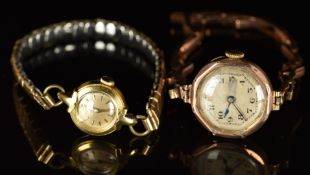 Two ladies wristwatches comprising an Omega 18ct gold example on expanding metal bracelet (18.4g)
