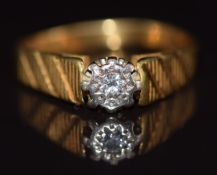 An 18ct gold ring set with a diamond in an illusion setting, 3.6g, size L