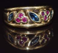 A 9ct gold ring set with round cut rubies and marquise cut sapphires in a floral design, 5g, size L