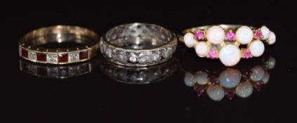 A 9ct gold ring set with cubic zirconia (1.9g, size P), silver ring set with synthetic opals and 9ct