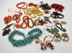 A collection of jewellery including coral necklaces, Art Deco brooches, agate necklace, turquoise