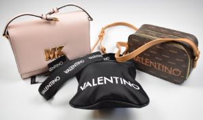 Three handbags by Michael Kors and Mario Valentino