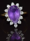 An 18ct gold ring set with a pear cut amethyst surrounded by diamonds, 4.6g, size P
