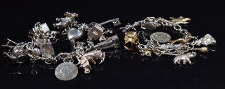A silver charm bracelet with eleven silver charms and one 9ct gold charm, together with another